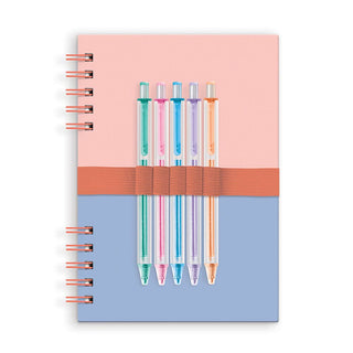 Notebook with colorful pens on a pink and blue background