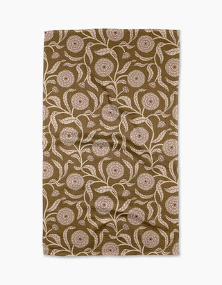 Patterned Geometry tea towel with floral design on a brown background