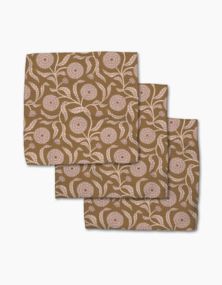 Set of three patterned dishclothes on a white background