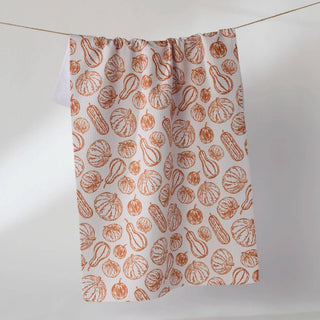 tea towel with brown vegetable pattern on a white background