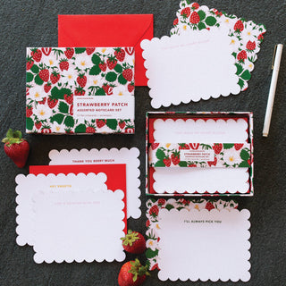 Strawberry-themed notecards and envelopes on a dark surface.
Strawberry notecard set