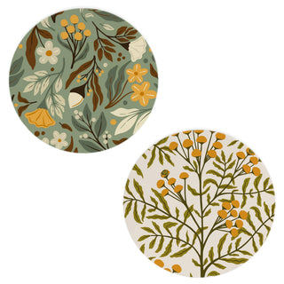 Two round coasters with floral patterns on a white background