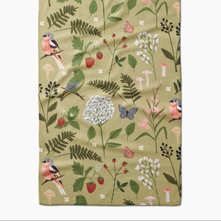 Floral and bird patterned tea towel with a green background