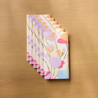 Set of floral Geometry Not Paper Towels on a wooden surface