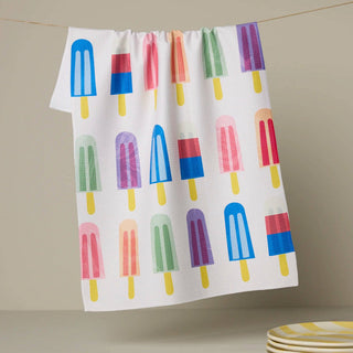 Kitchen towel with colorful popsicle pattern on a beige background